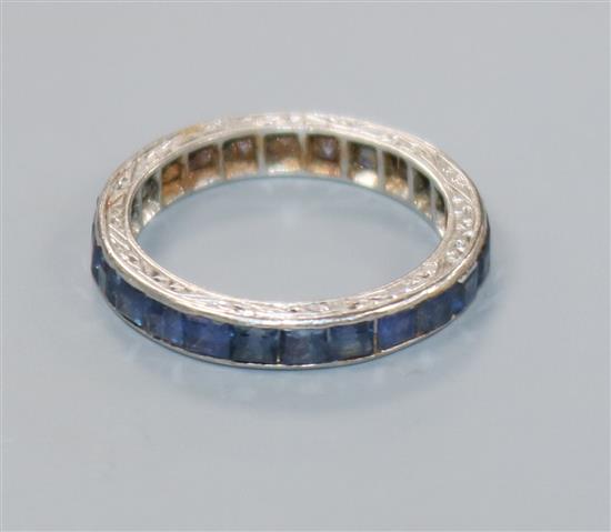 A white metal and sapphire set full eternity ring, size G.